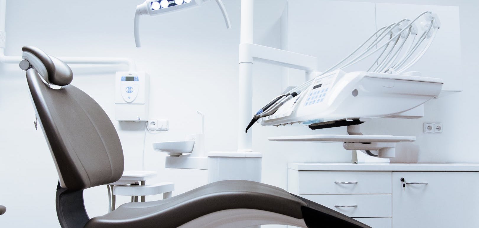 Image of patient chair in dentist room